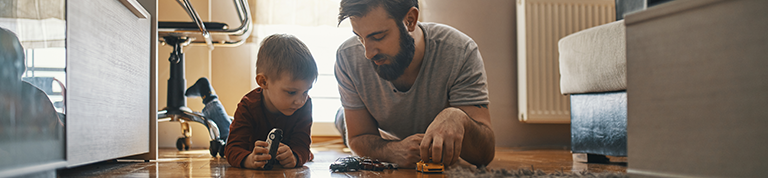 A father playing with his young son